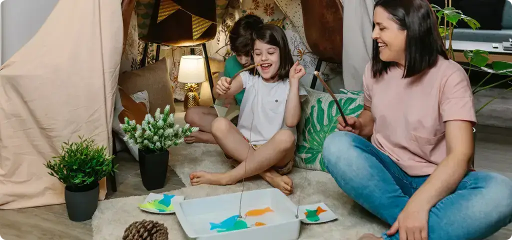 a RBT and a child playing with a stick