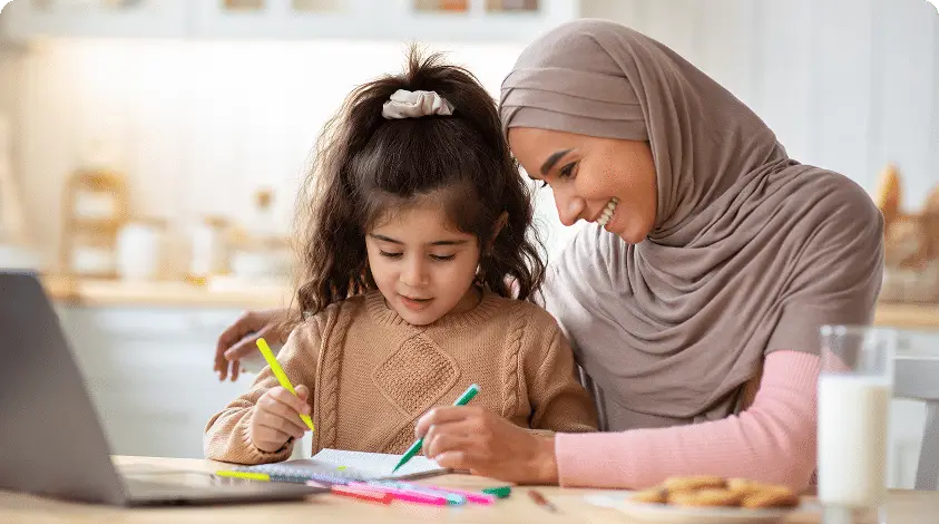 a Behavior Therapist and a child drawing